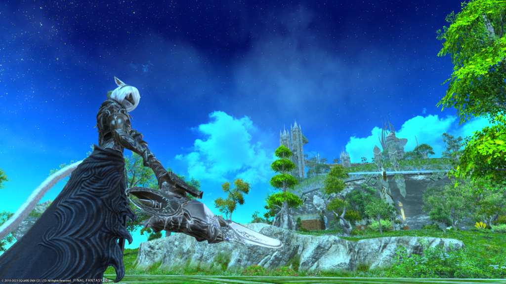 An FFXIV screenshot. A Miqote is posed in front a scenic parkland with stars in the sky.